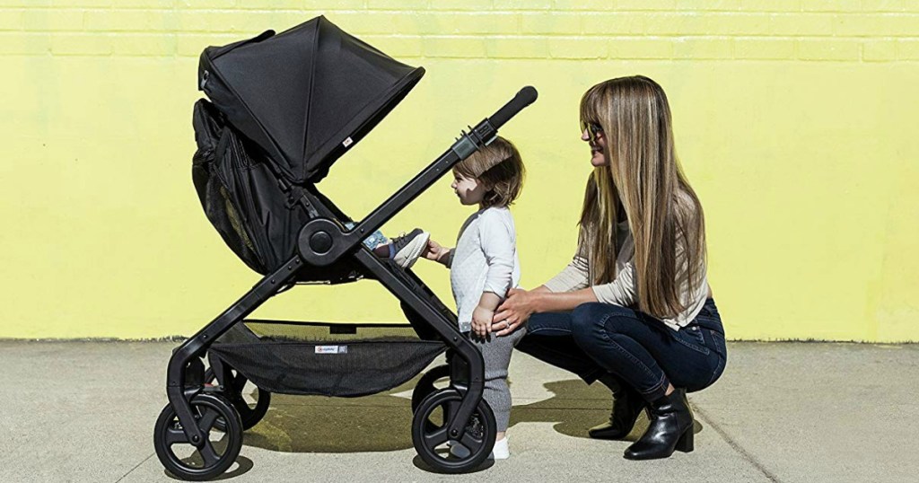 child and woman looking in stroller