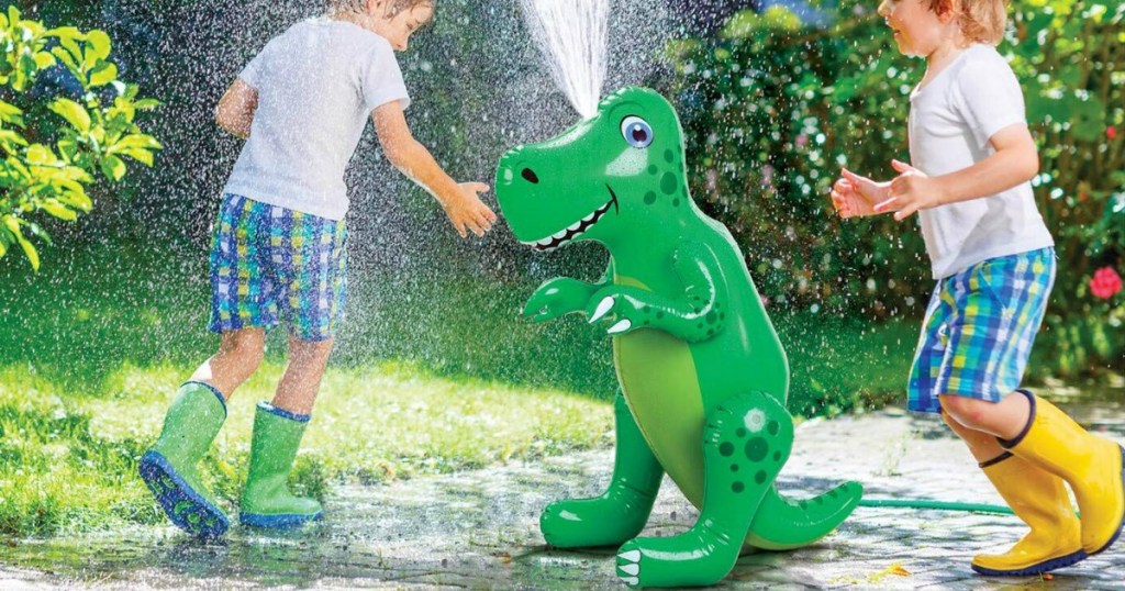 Kids playing in water squirting from Etna Green Inflatable Dinosaur Sprinkler