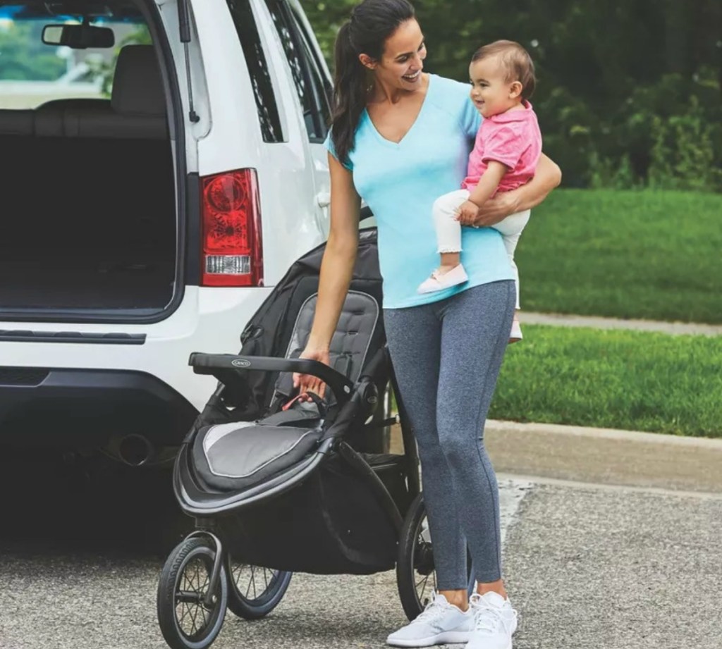 Woman with baby and jogging stroller