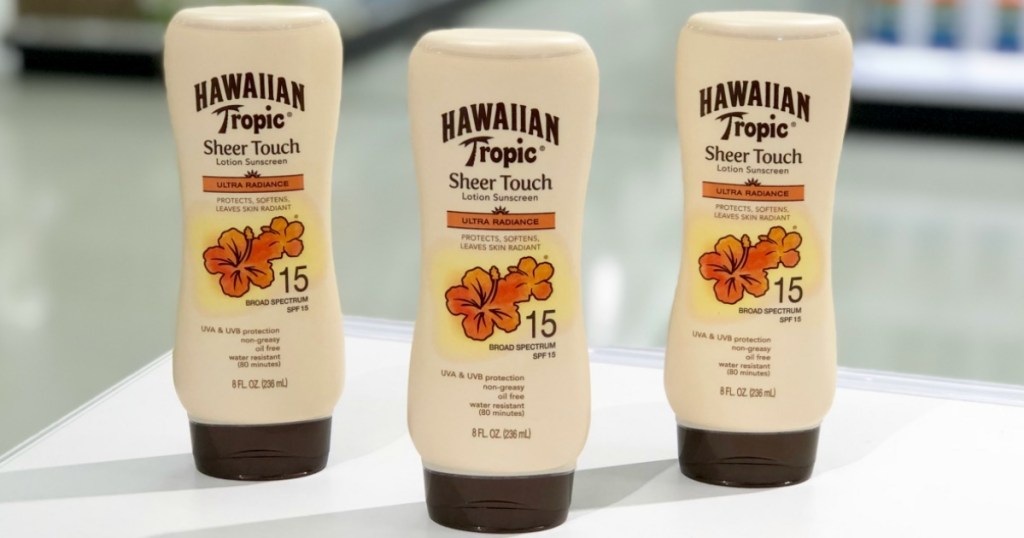 three Hawaiian Tropic Sheer Touch Sunscreen bottles