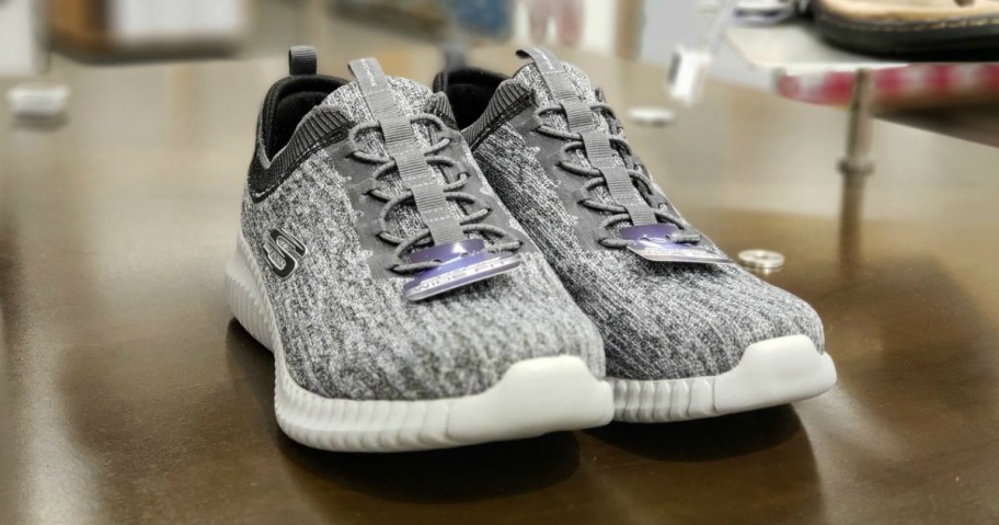 pair of grey sneakers