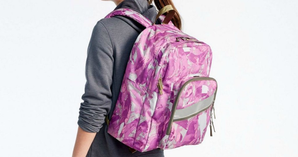 girl wearing pink backpack