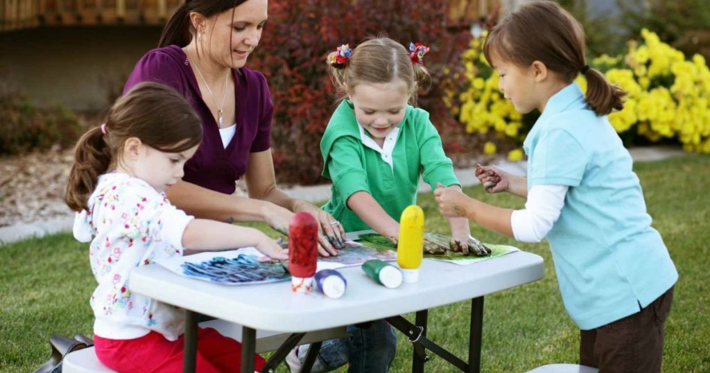 mom with kids at a small picnic