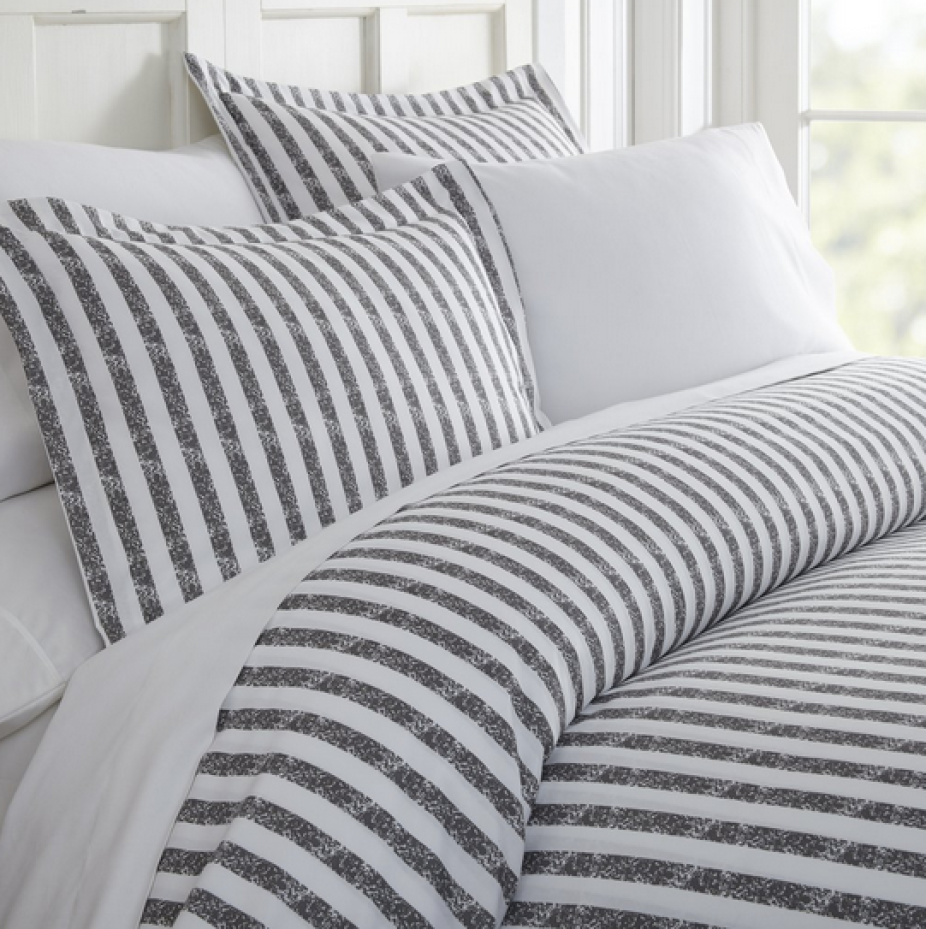 Queen bed featuring gray striped Linens & Hutch Duvet Cover Set