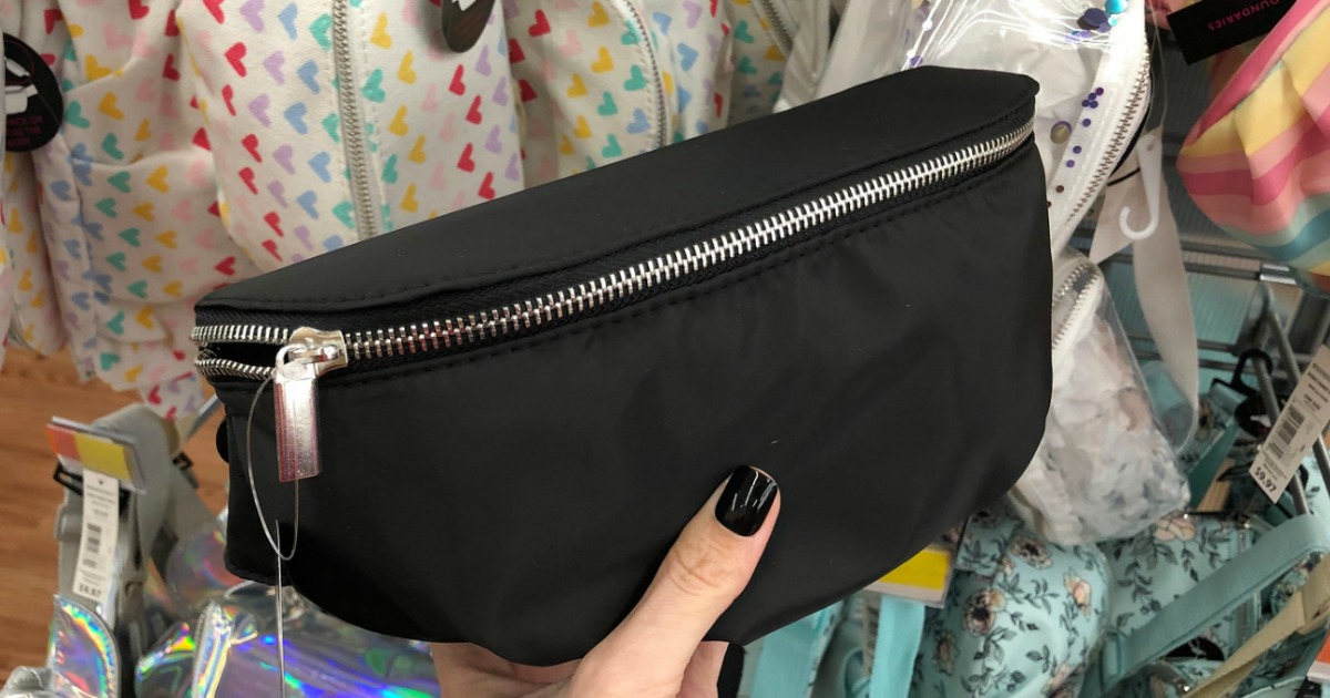 black fanny pack with silver zipper in store