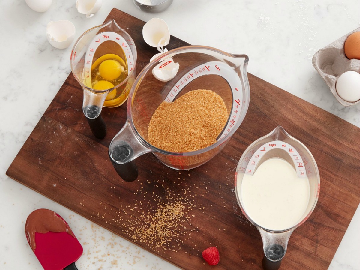 angled measuring cups filled with food sitting on cutting board