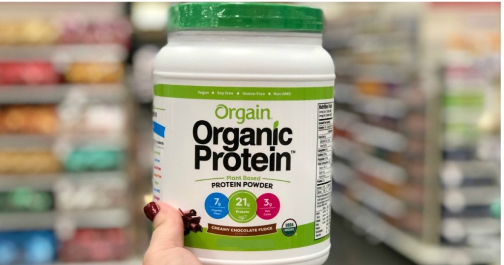 Orgain Organic Protein Being Held By a Woman's Hand