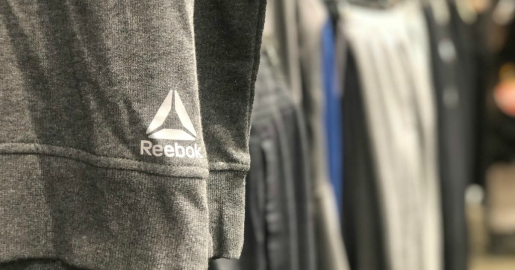 Reebok apparel hanging in store