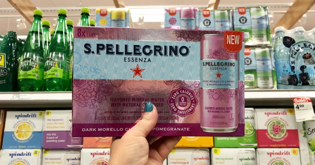 hand holding up S. Pellegrino water 