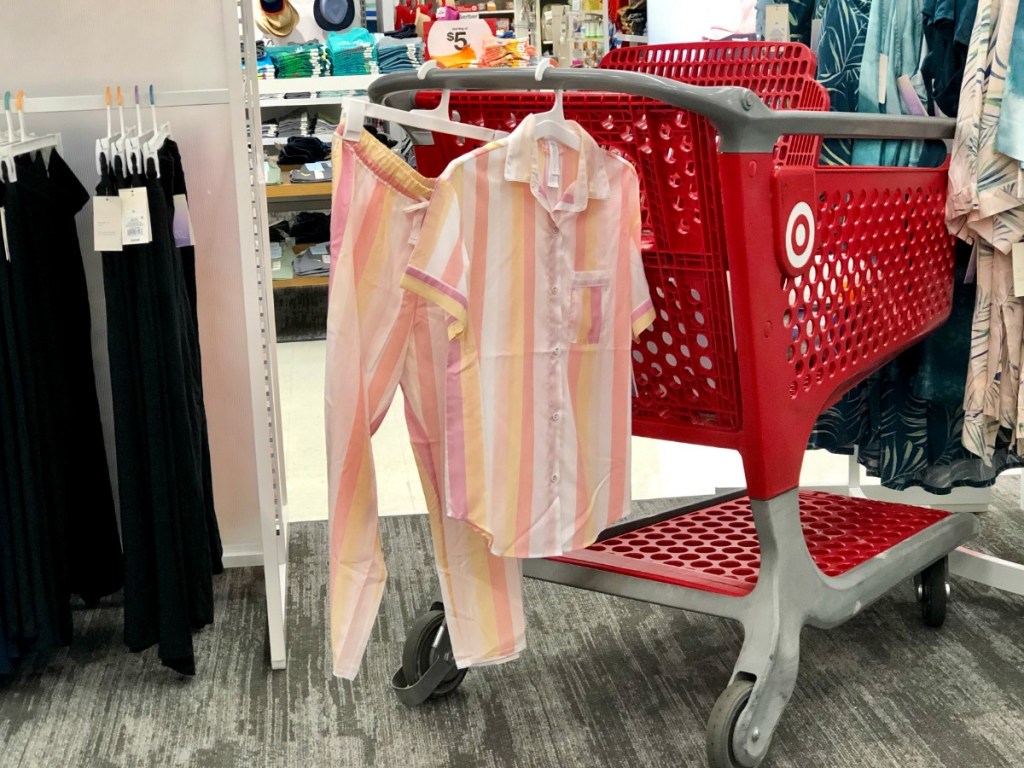 Striped women's pajamas hanging on cart