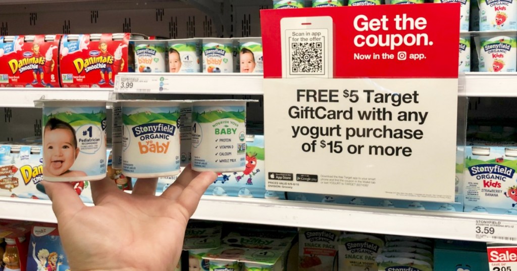 hand holding Stonyfield Organic Baby Yogurt at Target