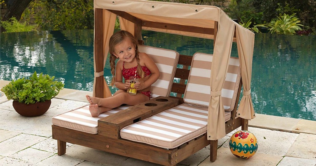 two seat children's lounger with striped cushions and tan canopy