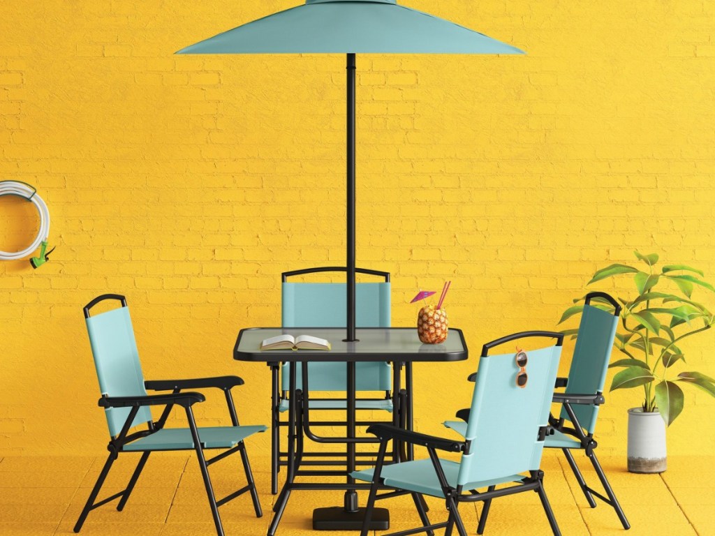 patio table with blue-green chairs