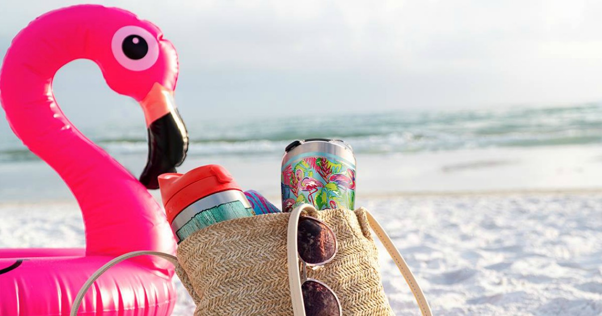 flamingo pool float by bag filled with Tervis tumblers