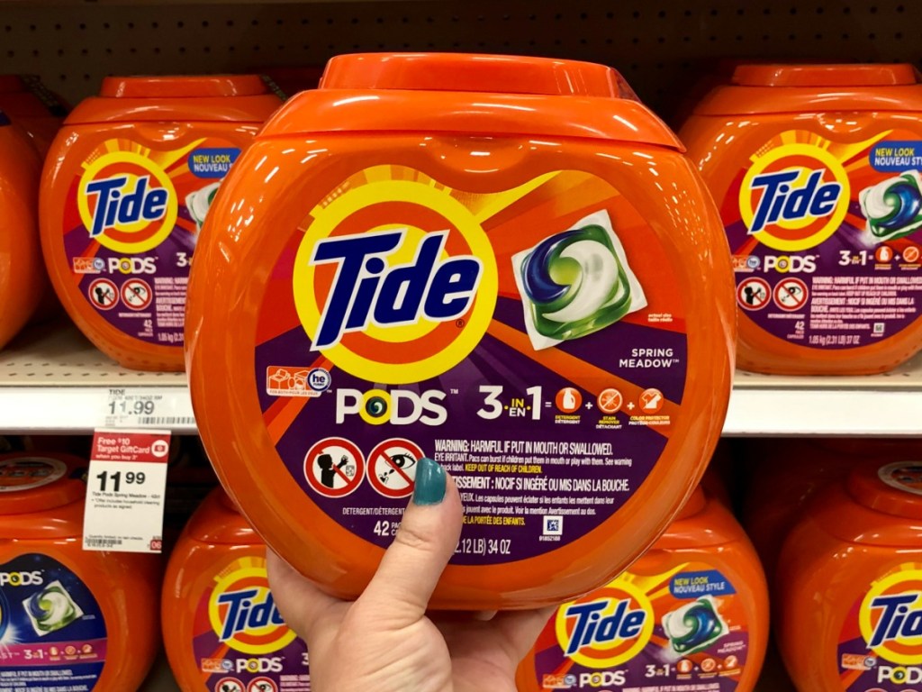 Tide Pods held up in front of Target Shelf