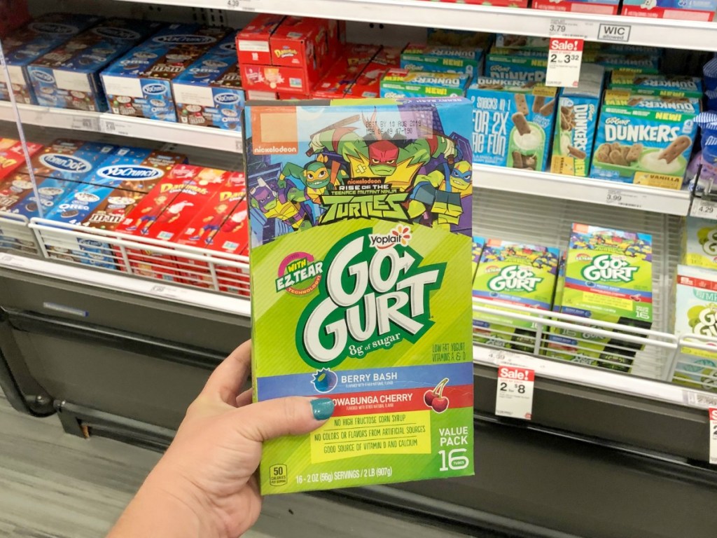 Hand holding big gogurt yogurts featuring Teenage Mutant Ninja Turtles