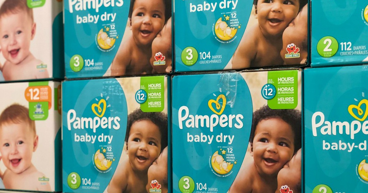 boxes of pampers baby dry diapers on store shelf