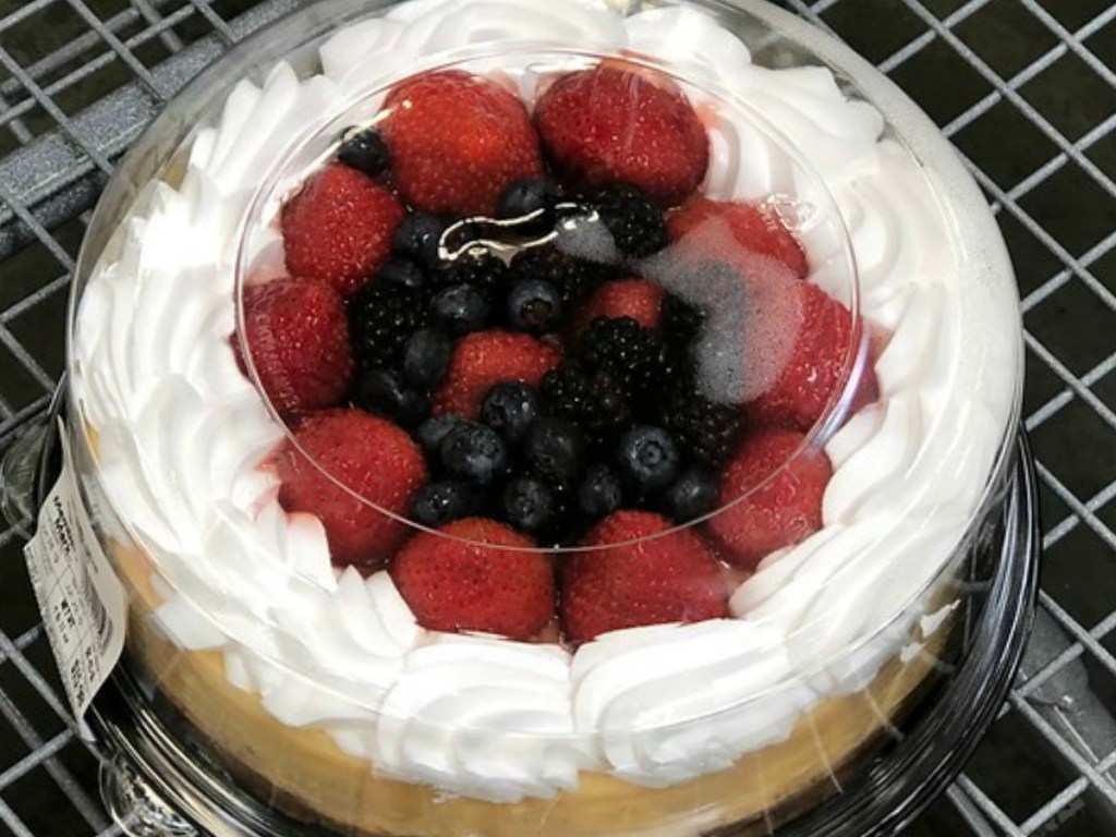 cake topped with strawberries and blueberries