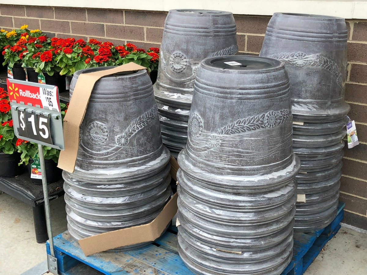 stacks of planting posts near store sign