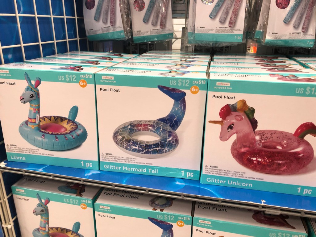 Shelf of llama, mermaid, and unicorn creatology pool floats at michaels