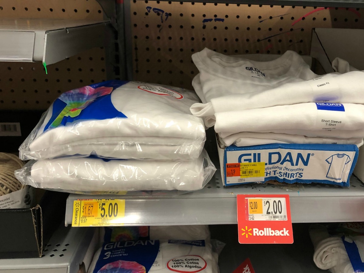 kids white t-shirts on shelf at Walmart with clearance and Rollback tags