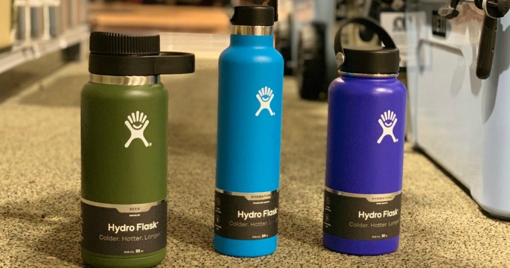 three water bottles sitting on store floor