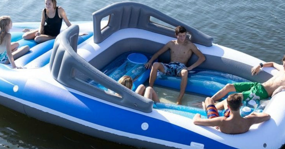 inflatable speed boat float with people in the boat in the water