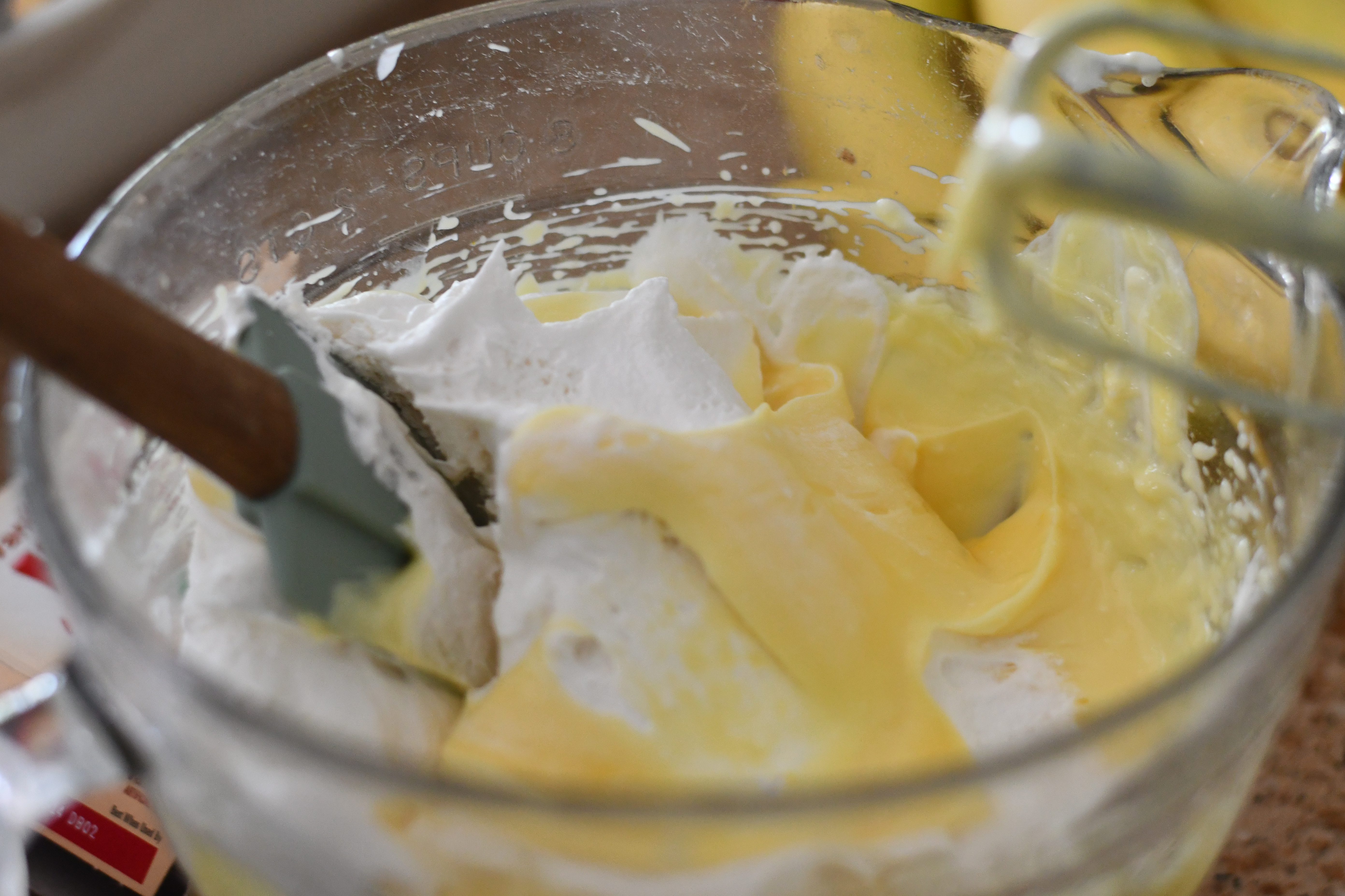 mixing up a bowl of vanilla pudding with whipped topping 