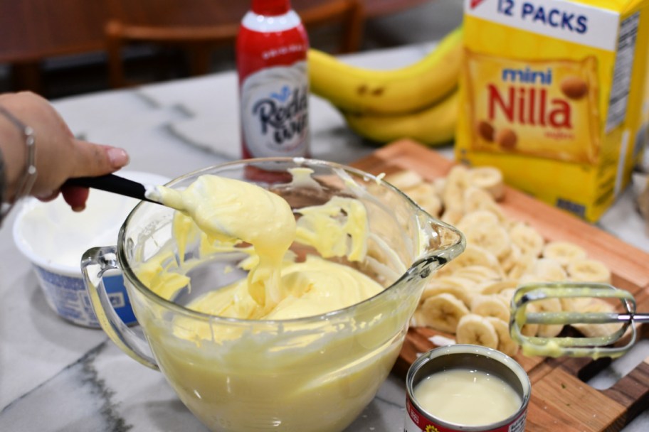 mixing banana pudding in a bowl