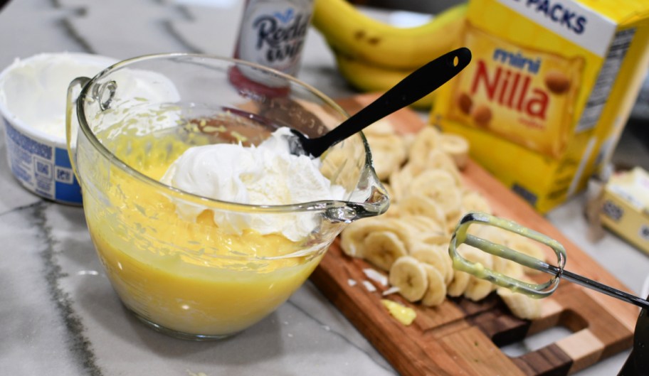 mixing whipped topping and pudding 