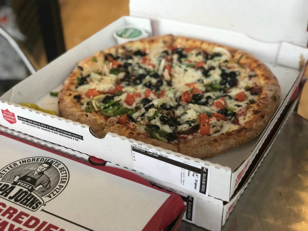 pizza in open box on the counter