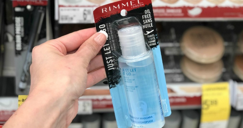 Hand holding rimmel eye makeup remover at walgreens