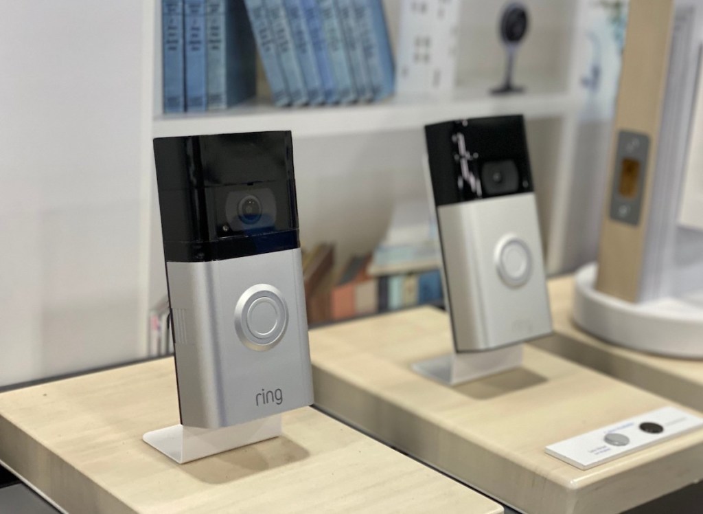 two silver ring doorbells on store display