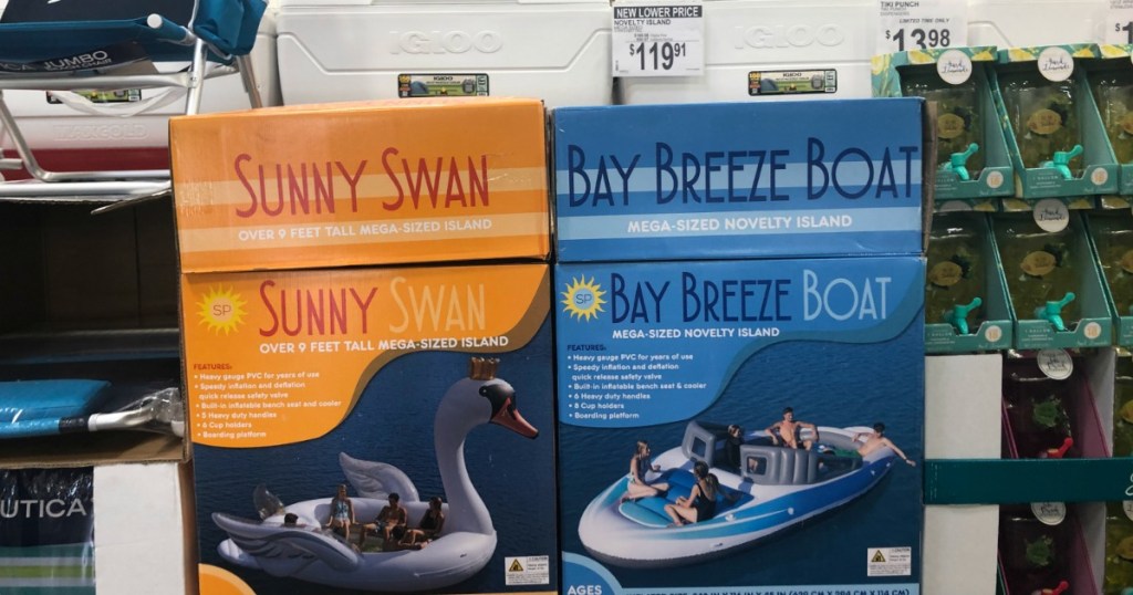 huge inflatable swan and boat in boxes at sam's club