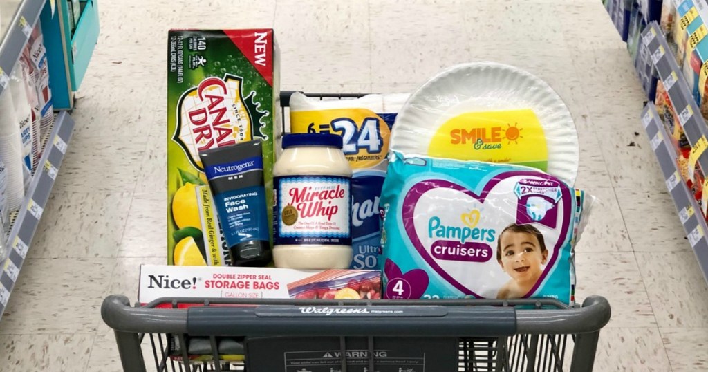 canada dry ginger ale and lemonade 12-packs, kraft miracle whip, and pampers cruisers diapers in cart at walgreens