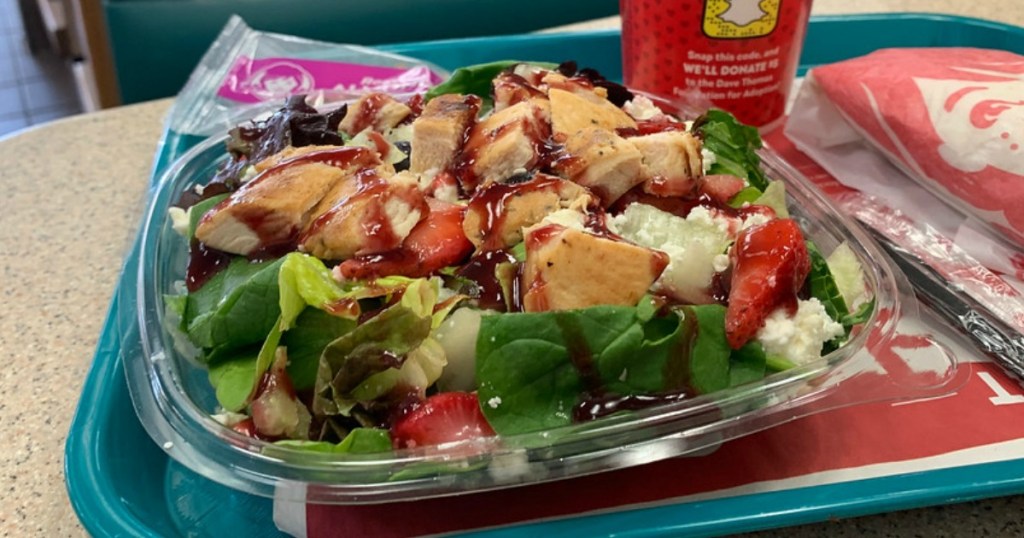 berry burst chicken salad sitting on a tray with a drink at wendy's