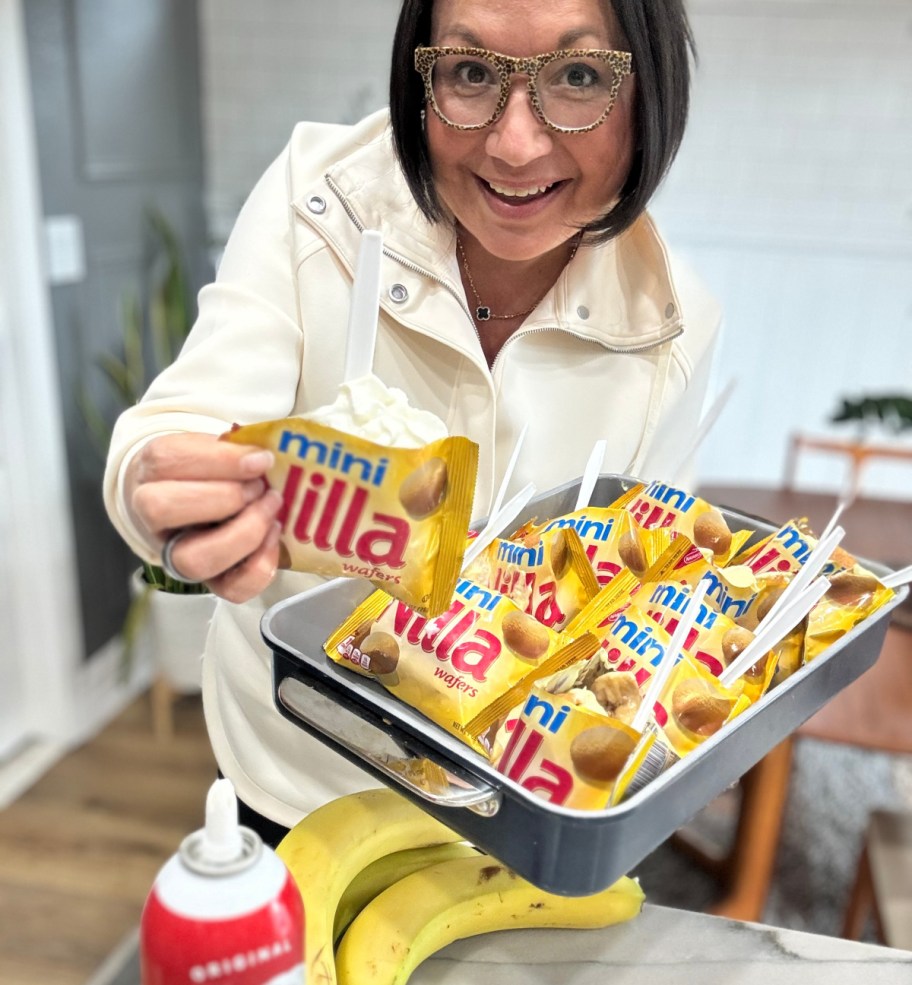 woman holding vanilla wafer walking tacos