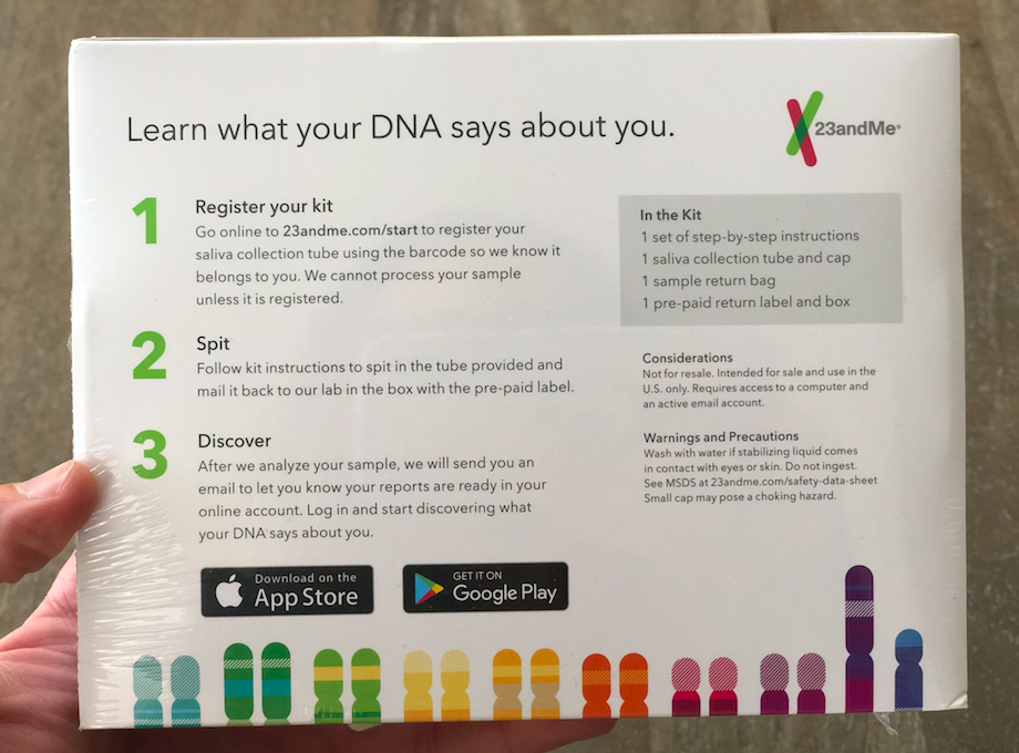 Person holding back of 23andMe DNA Test w/ Health + Ancestry box