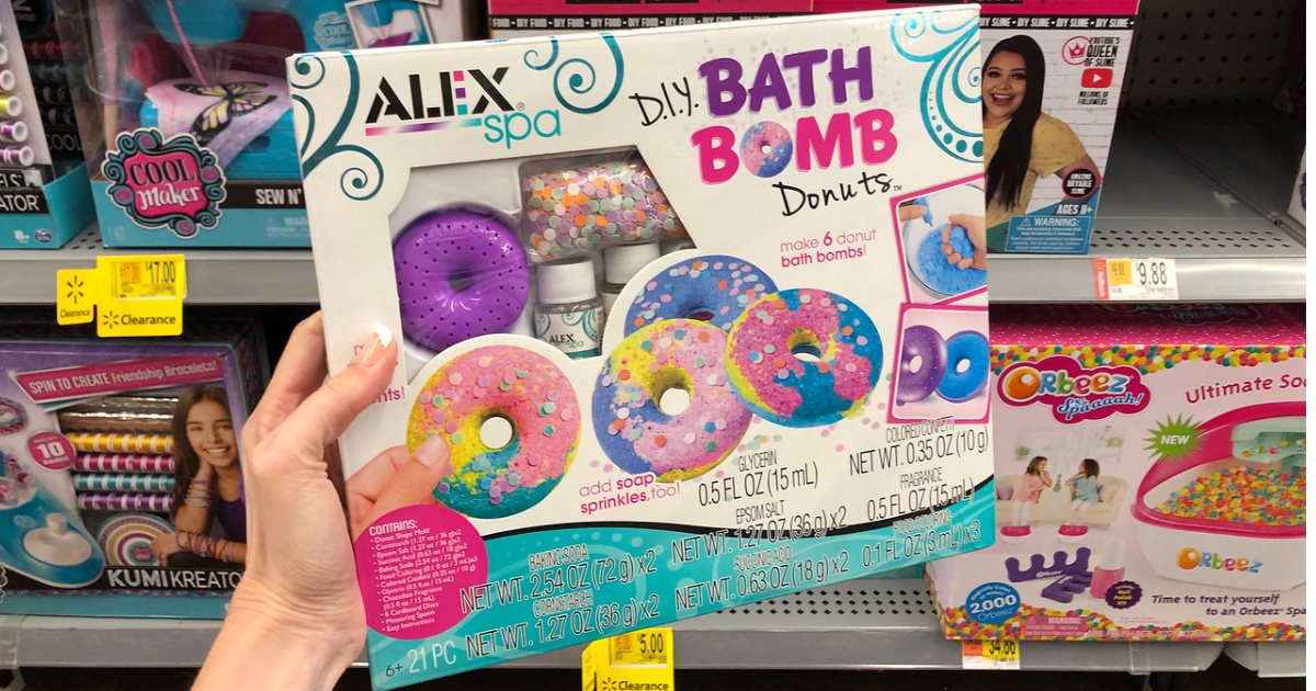 woman holding alex spa donut bath bombs at walmart