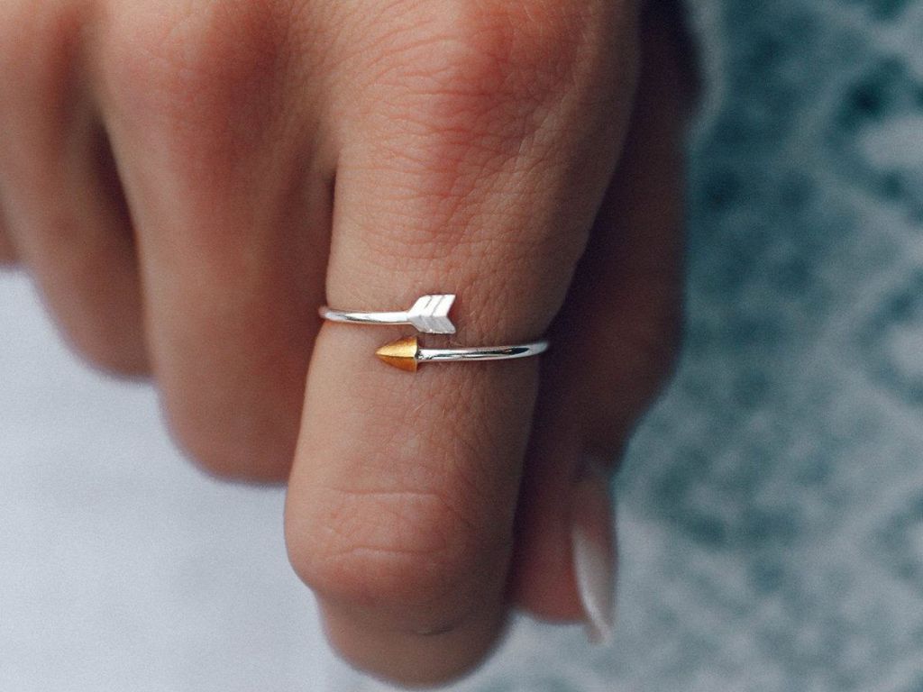 Woman wearing arrow ring pura vida