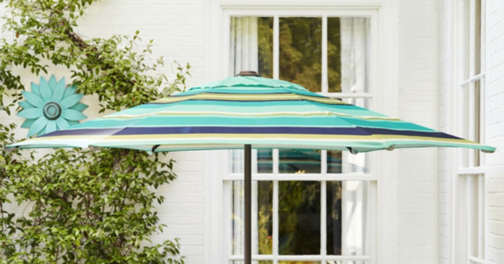 Blue striped patio umbrella on patio