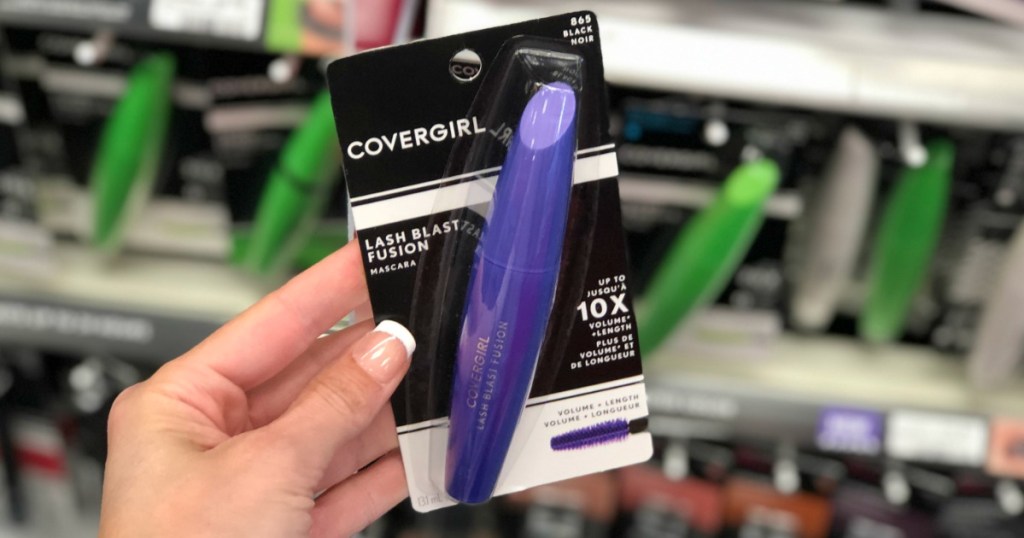 hand holding CoverGirl mascara