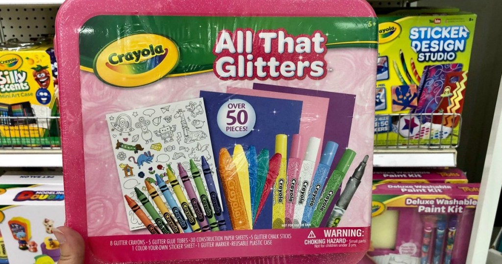 Crayola All That Glitters 50-Piece Art Case infront of other Crayola sets in store