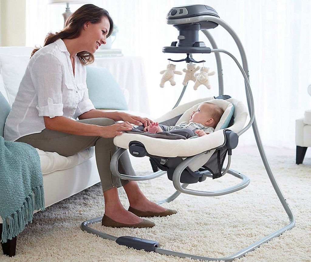 Mom with infant in a Graco duetsoothe swing rocker