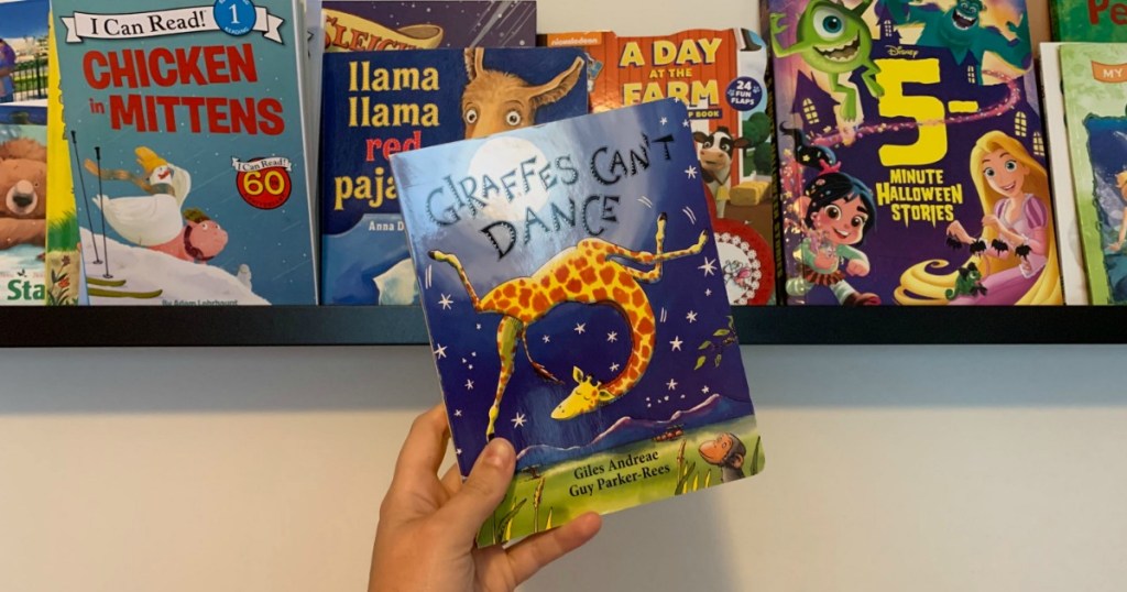 Giraffes Can't Dance book in front of bookshelf