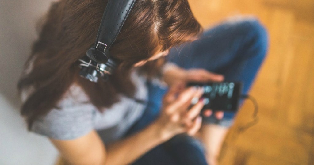 girl listening to music on phone