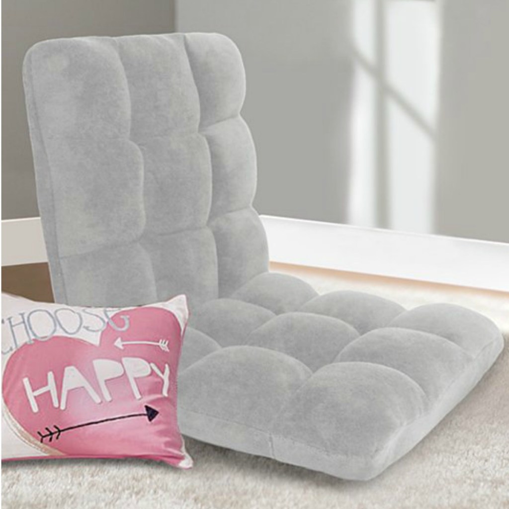 cozy grey chair on a bedroom floor