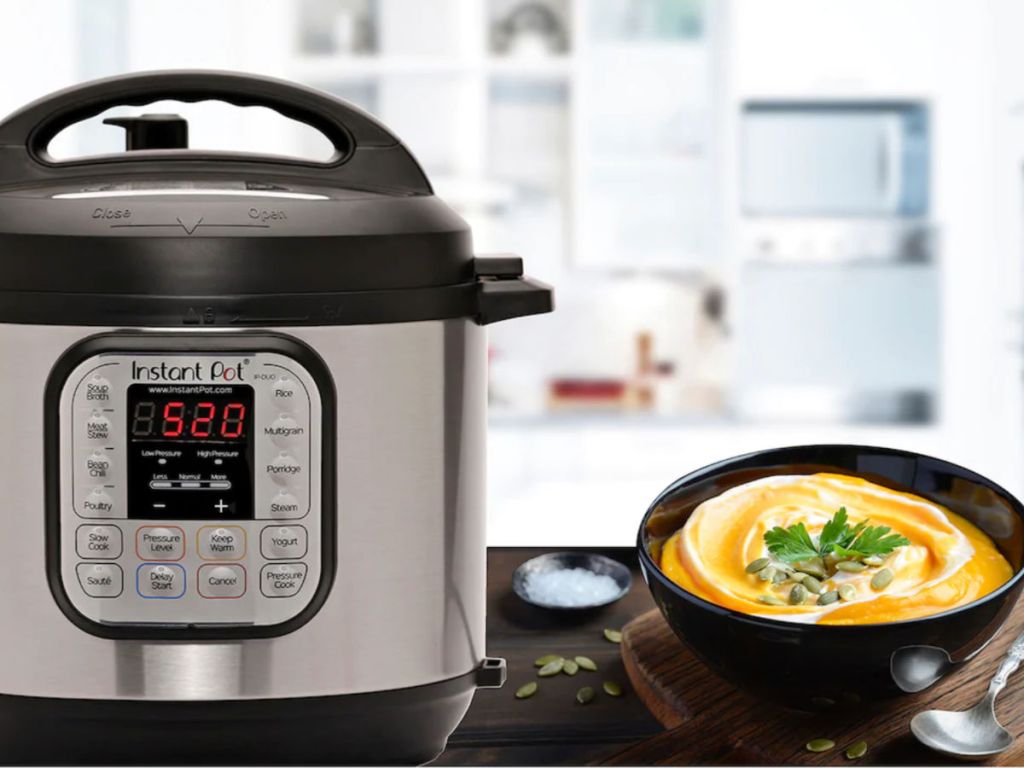 Instant Pot Duo 7-in-1 Programmable Pressure Cooker with queso cheese in a bowl