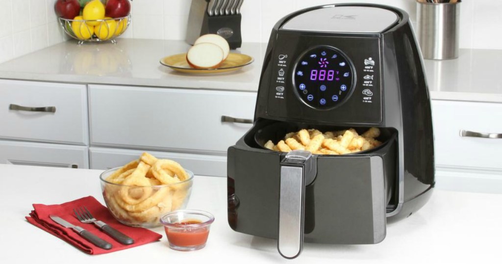 Kalorik Air Fryer in counter next to onion rings