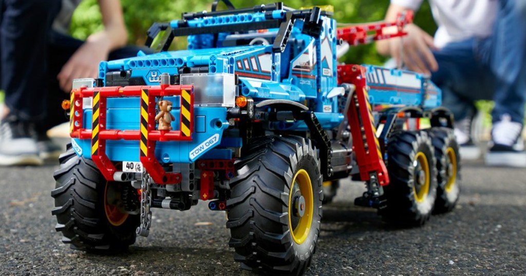 Boys playing with LEGO truck